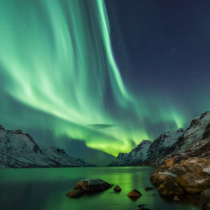 Northern Lights above waters edge, travel