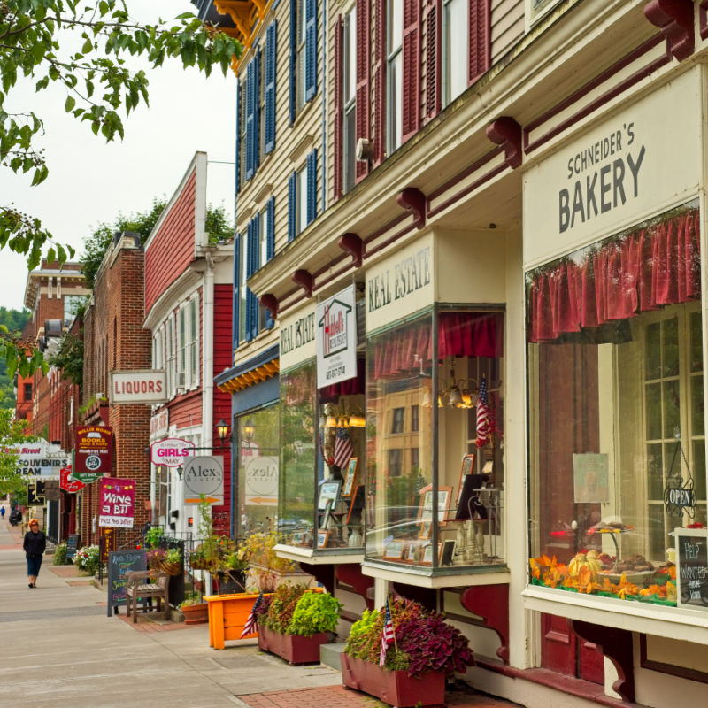 cooperstown stores along a sidewalk