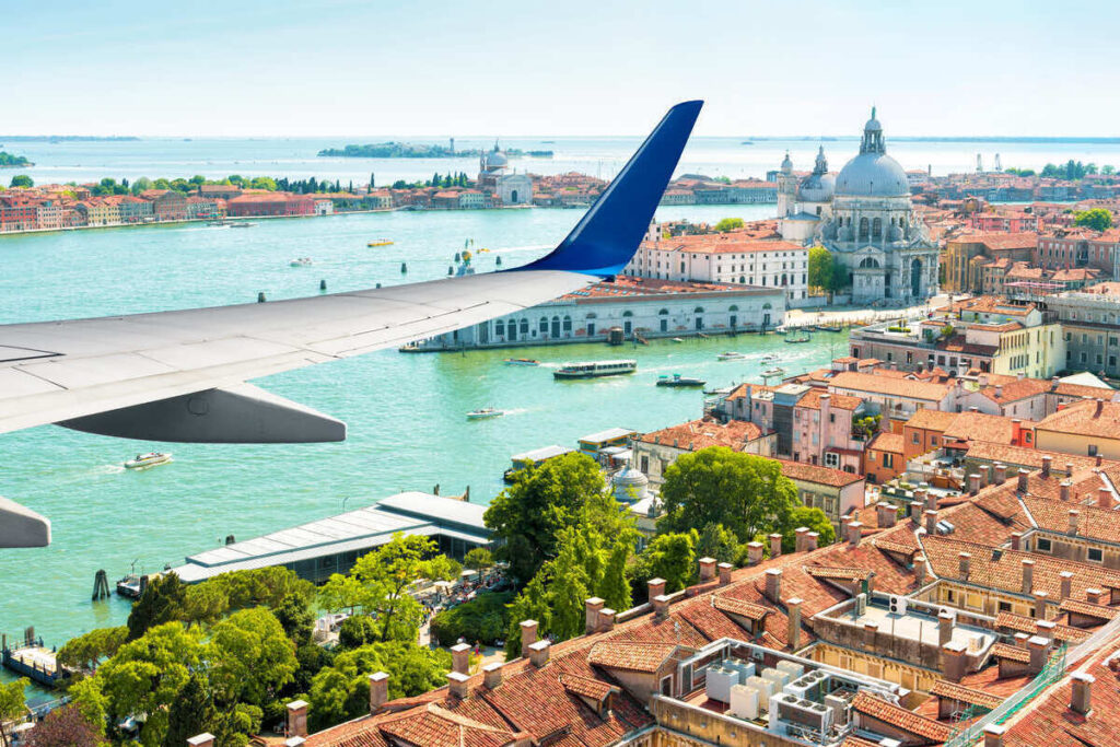 Plane Window Of Venice As An Aircraft Hovers Above The City, Italy, Europe