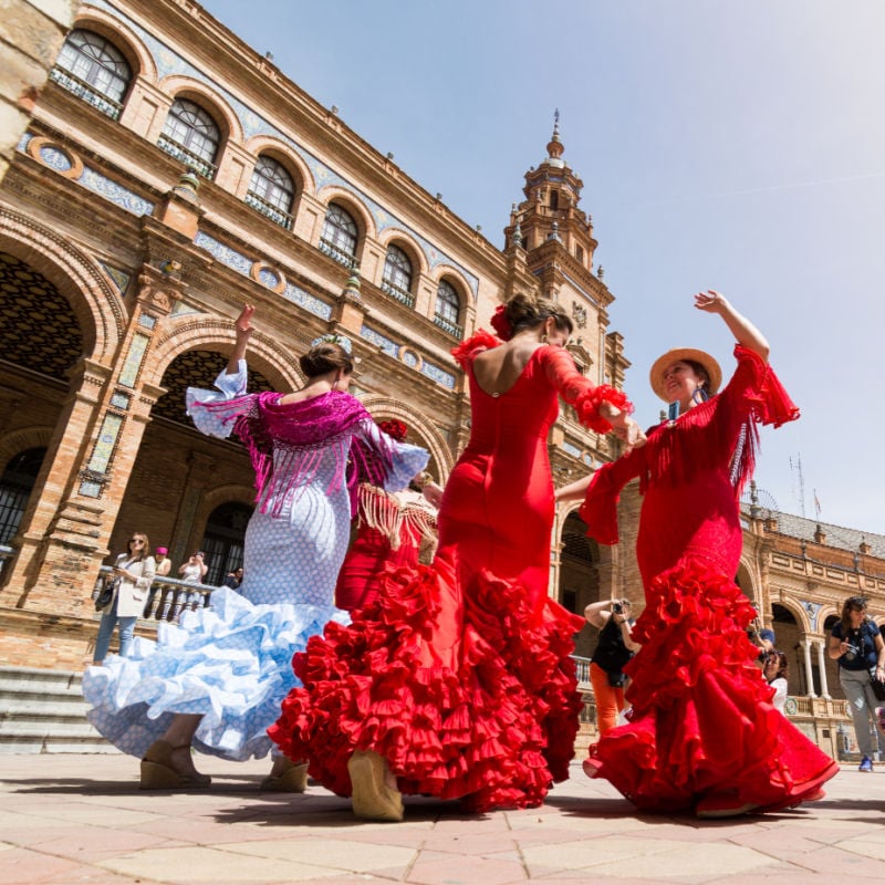 flamenco dancers at the plaza de espana in seville