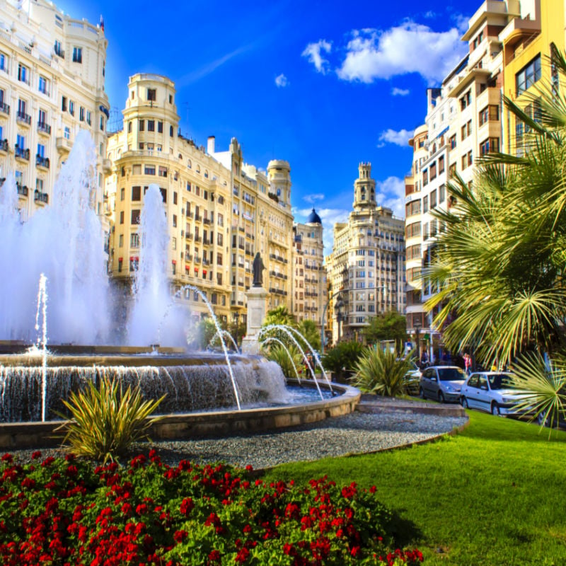 Main city square of Valencia, The Plaza del Ayuntamiento in bright afternoon colors, Spain