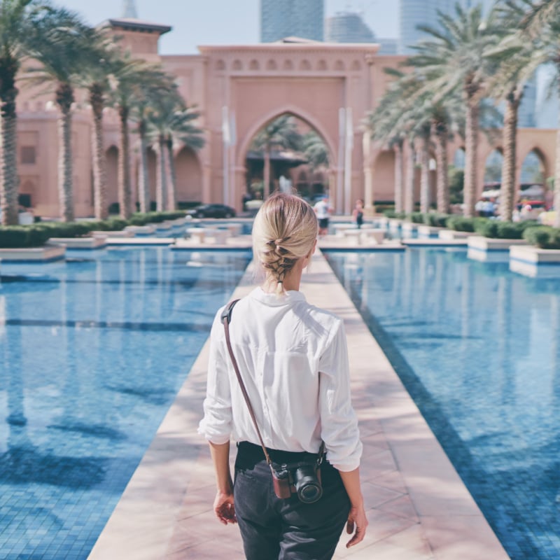 woman exploring beautiful luxury hotels and landmarks in dubai UAE