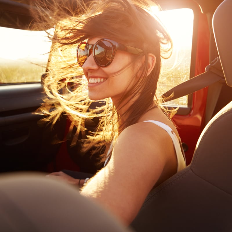 smiling passenger on road trip